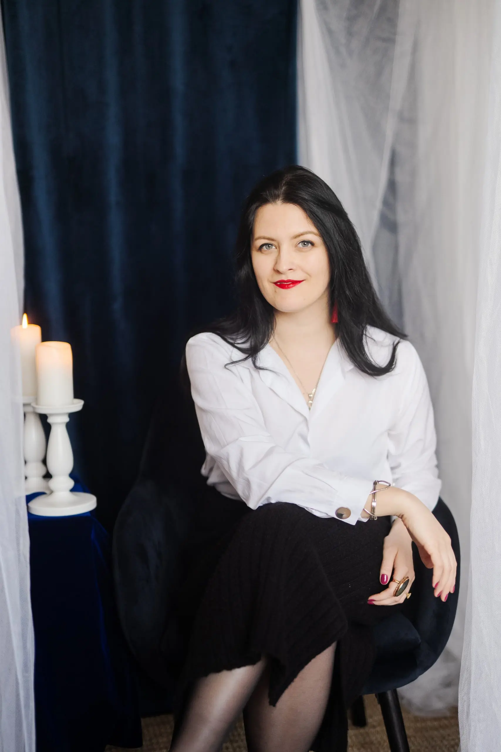 Diana Coman beside candlelight
