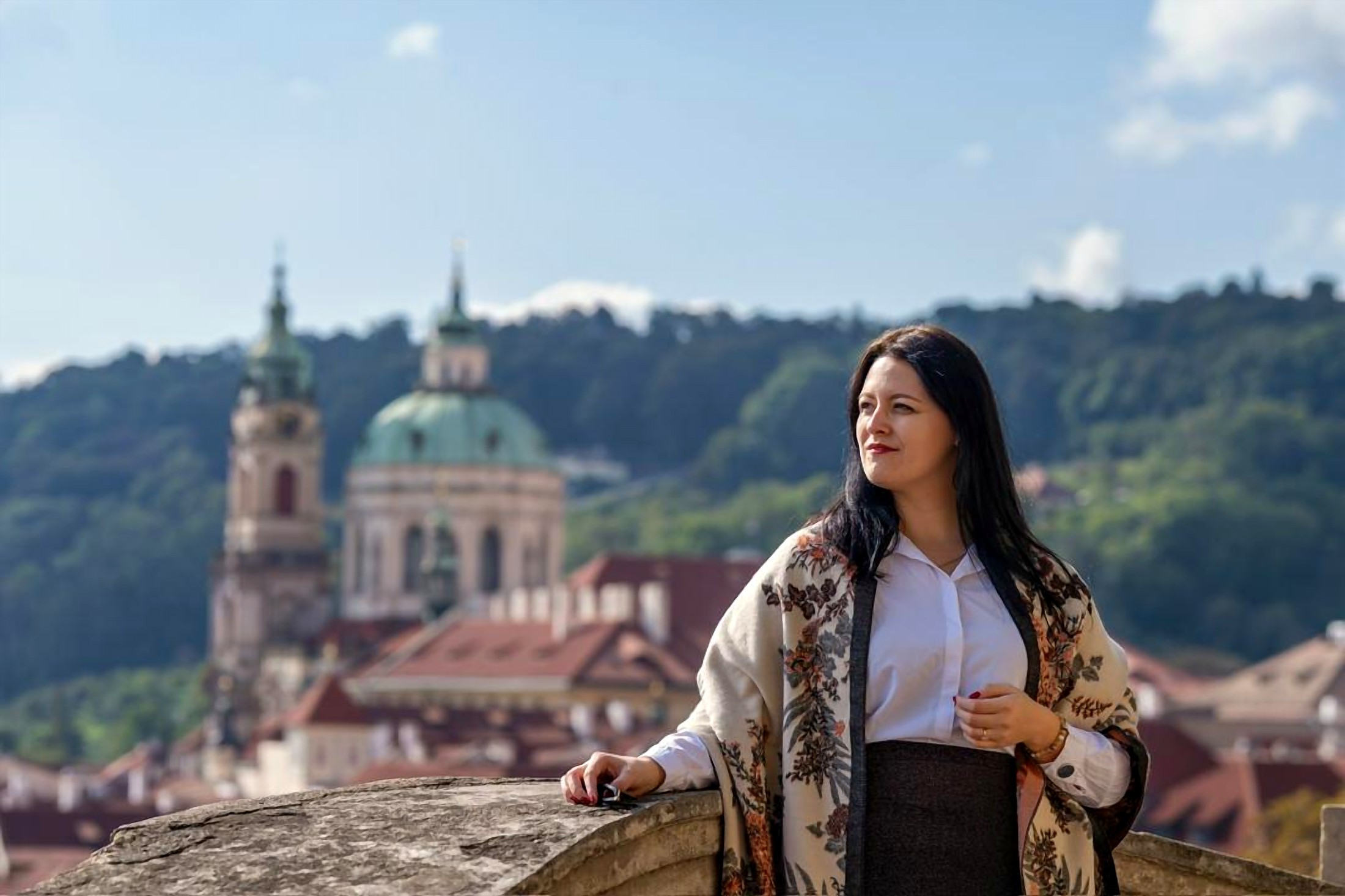 Diana Coman looking out over the rooftops of Prague