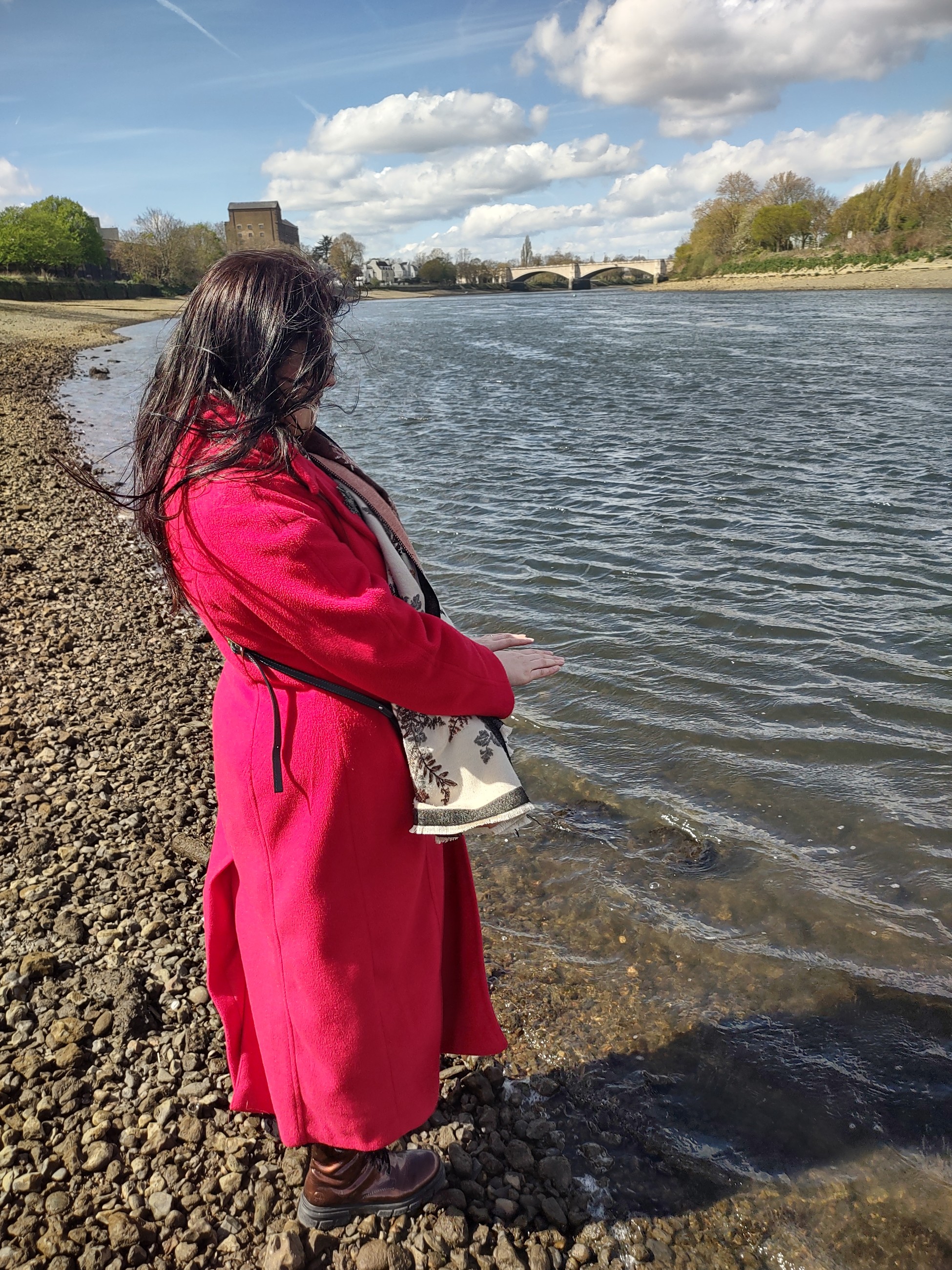 Diana Coman standing at the water's edge